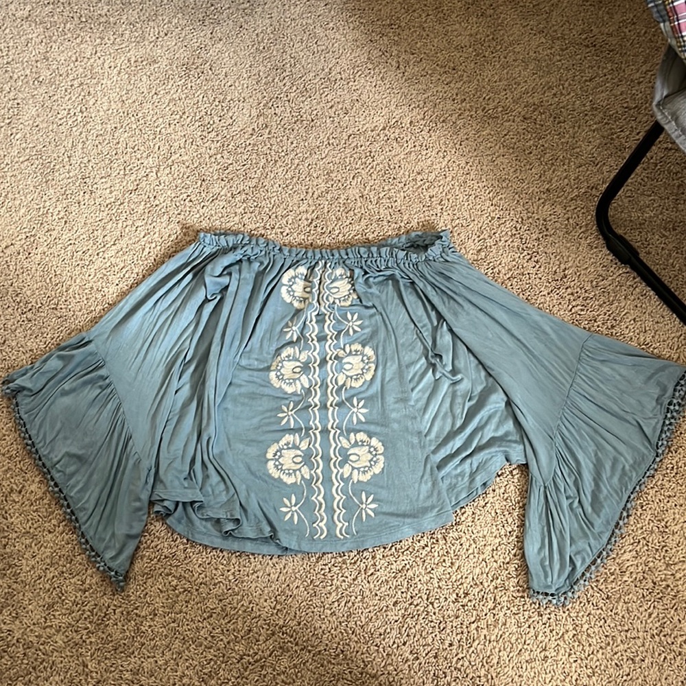 Blue sleeveless shirt